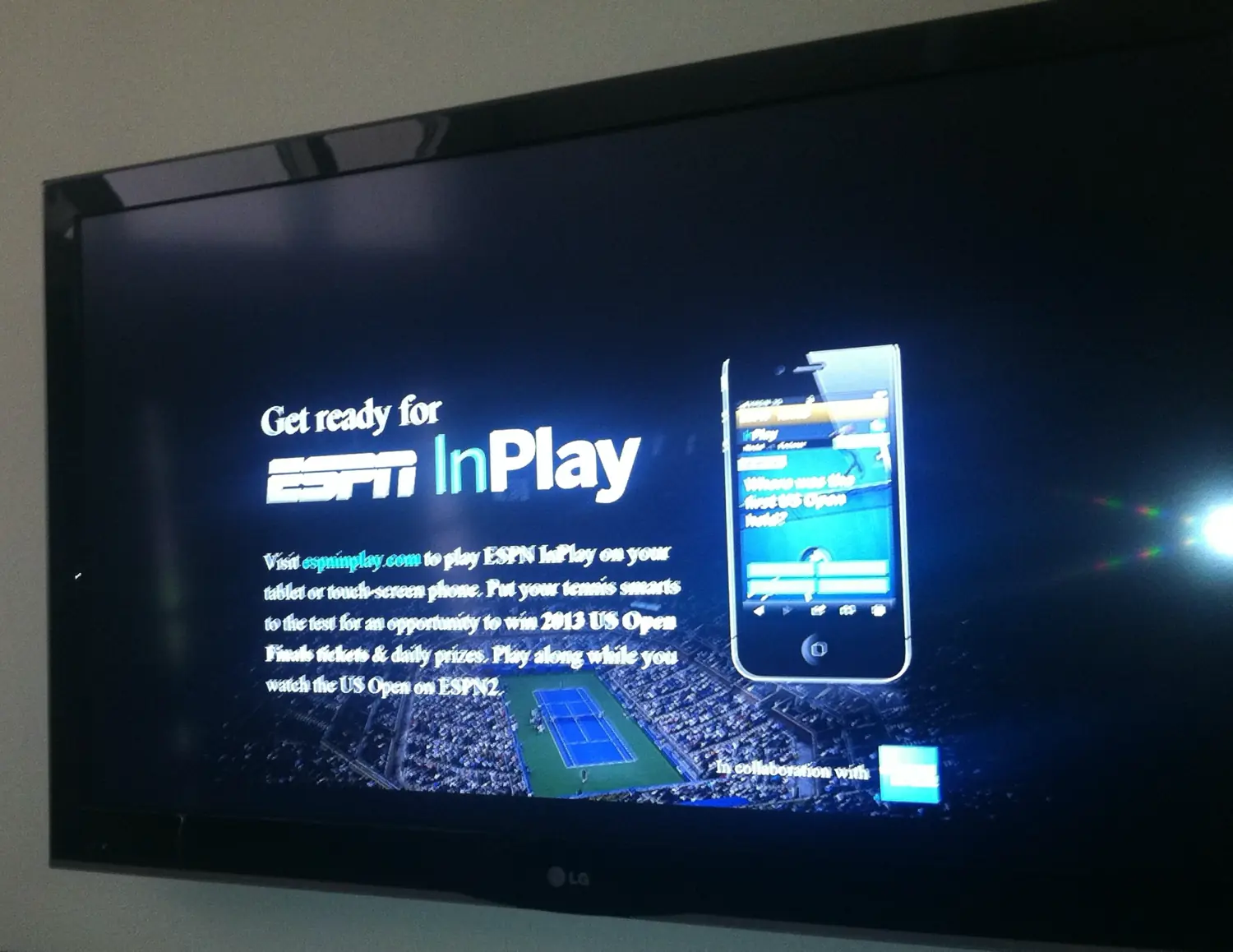An ESPN broadcast promo on a living-room TV reading 'Get ready for ESPN InPlay' — directing viewers to espninplay.com to play along on their phone or tablet during the 2013 US Open on ESPN2.