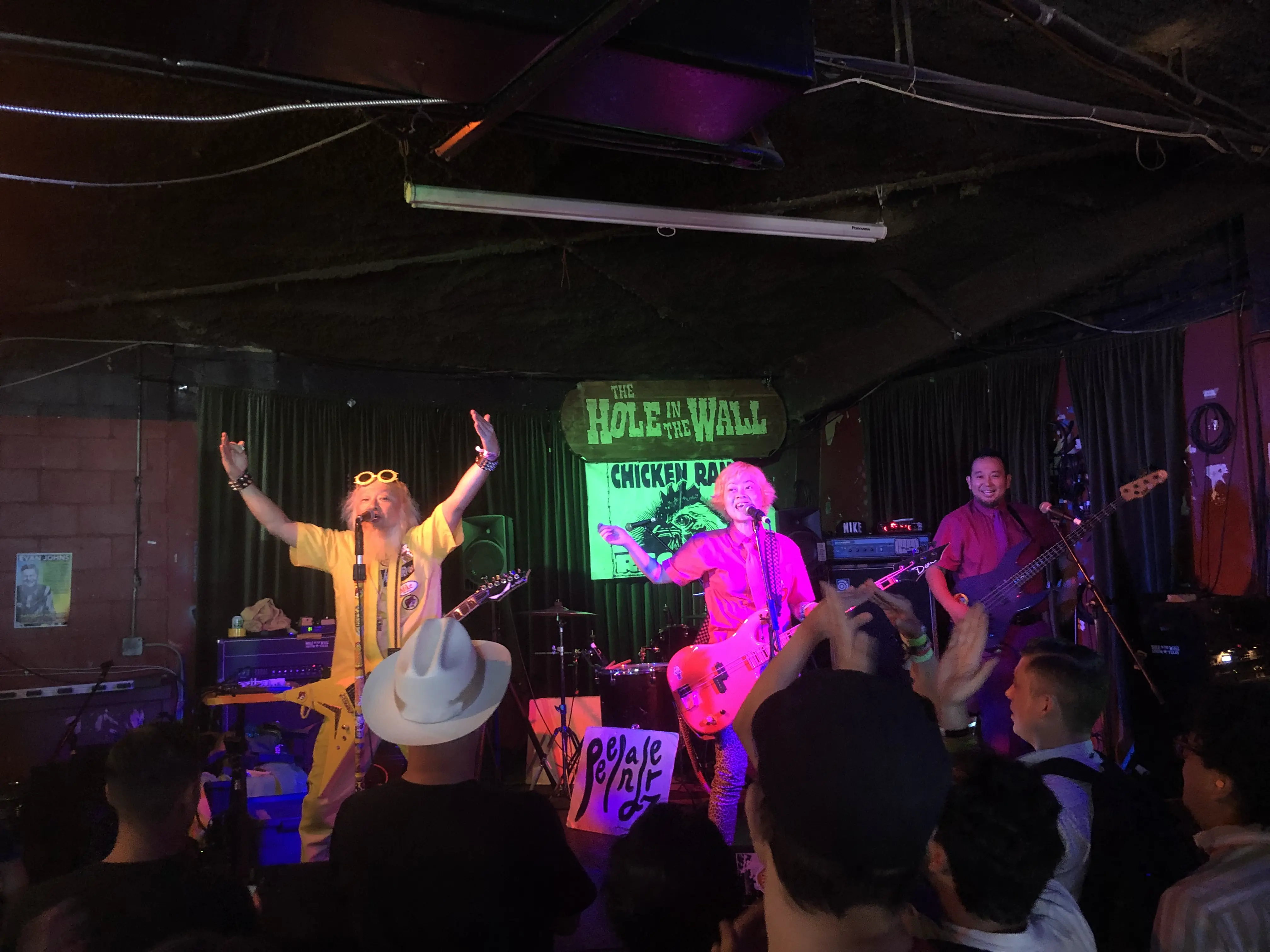 Peelander-Z performing live at The Hole in the Wall, the crowd packed against the stage